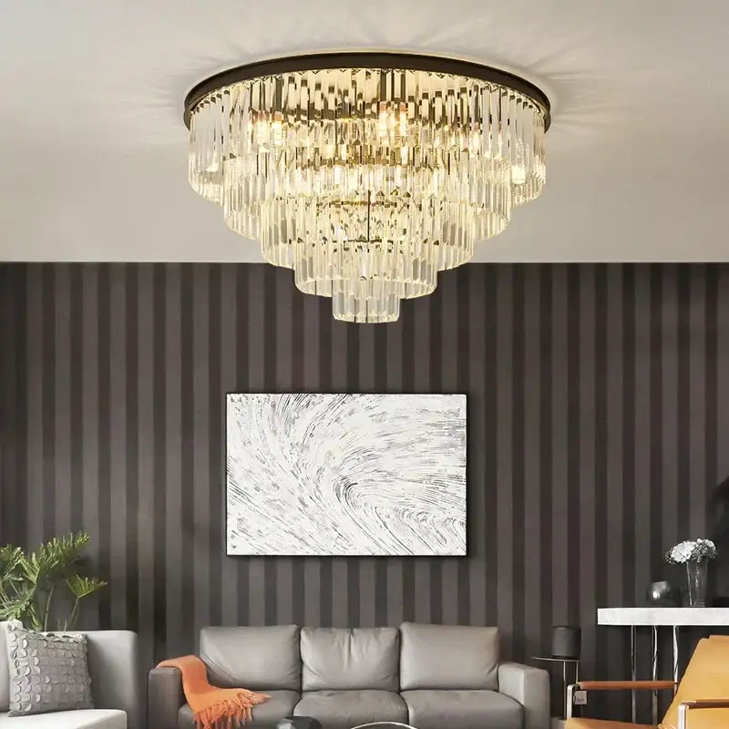 A multi-tiered decorbites black gold crystal ceiling chandelier with dark metal frame and cascading clear glass prisms