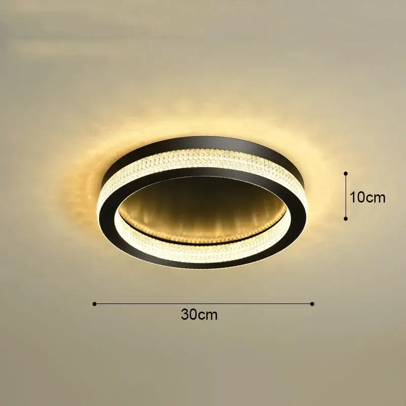 DecorBites black gold crystal chandelier ceiling light with sleek black frame and warm golden LED rings for living room