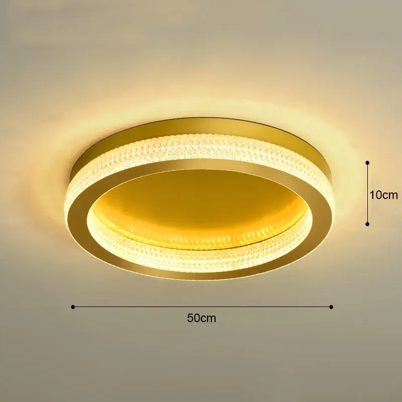 DecorBites black gold crystal chandelier ceiling light with gold-toned circular design and warm yellow LED illumination