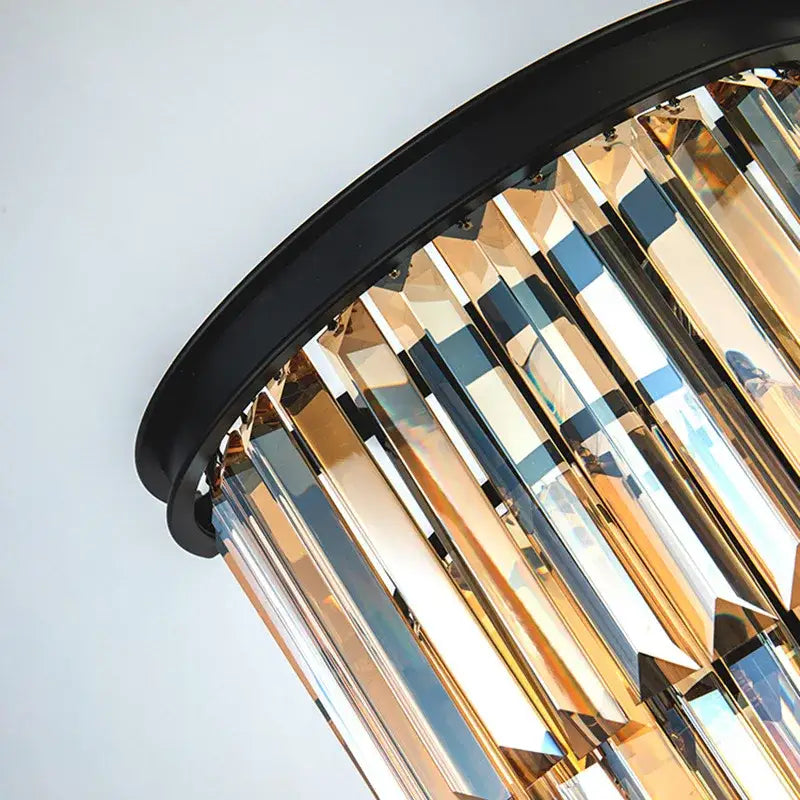 A decorbites black gold crystal modern led sconce featuring a sleek black frame with cascading gold prisms for living room