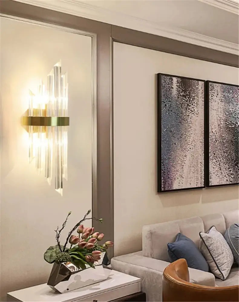 Decorbites™ black gold crystal wall sconce with vertical crystal prisms casting warm light for home décor