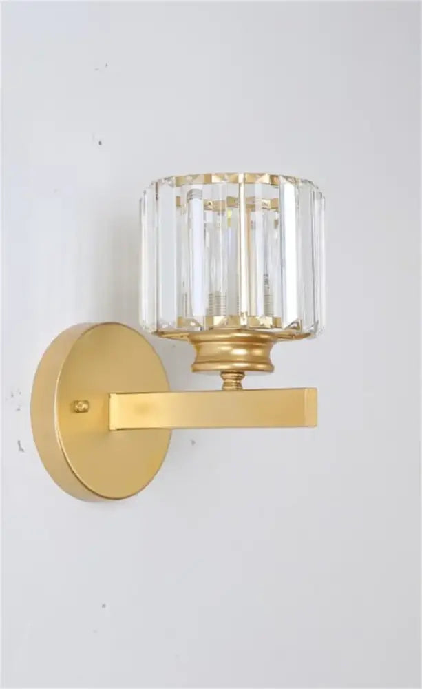 DecorBites black gold crystal wall sconce with cylindrical faceted crystal shade for bedroom and living room decor