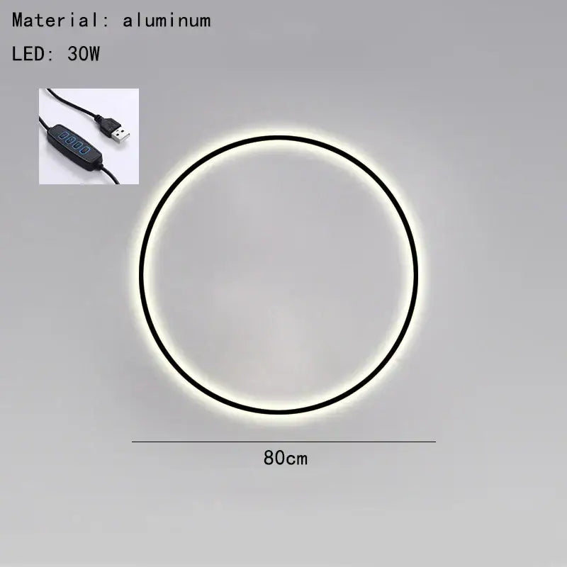 Circular aluminum DecorBites Black Gold wall light with sleek black frame glowing white illumination USB plug bedroom sconce