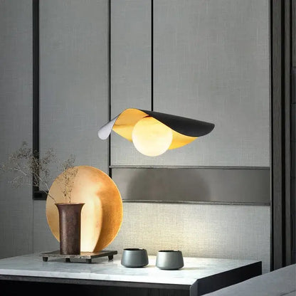 Modern pendant light with sleek curved black gold metallic design by decorbites black gold for retro nordic decor