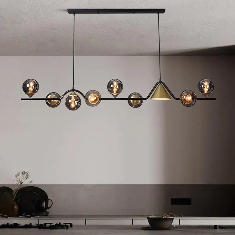 Modern black metal DecorBites black gold glass chandelier with spherical smoked glass shades and gold glass triangular accent