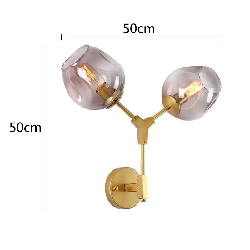 Gold-toned decorbites black gold wall lamps with two frosted glass globes and exposed filament bulbs for modern lighting