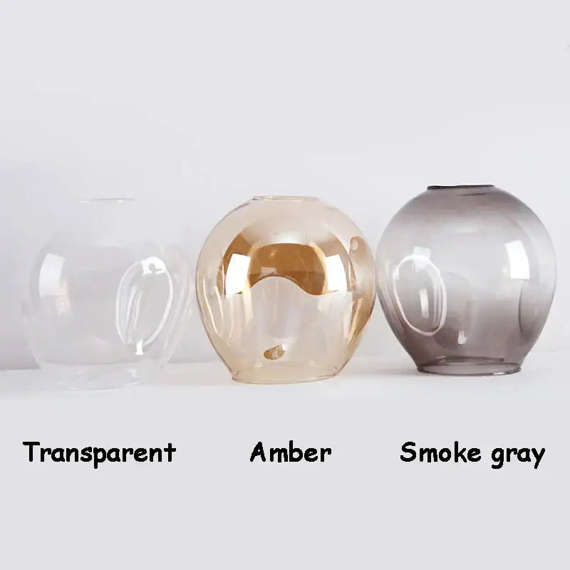 Decorbites black gold wall lamps with three spherical glass shades in transparent amber and smoke gray finishes for modern lighting