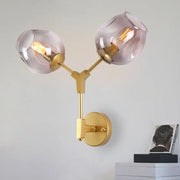 Decorbites black gold wall lamps featuring gold-toned metal with two frosted glass globe shades for modern lighting