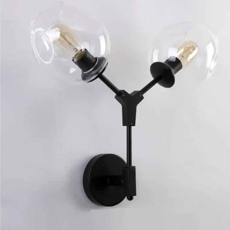 Decorbites black gold wall lamps featuring black metal sconces with two clear glass globe shades for modern lighting