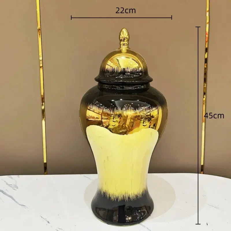 Decorbites black gold gradated ceramic jar with smooth yellow to black base and matching gold lid for home decor