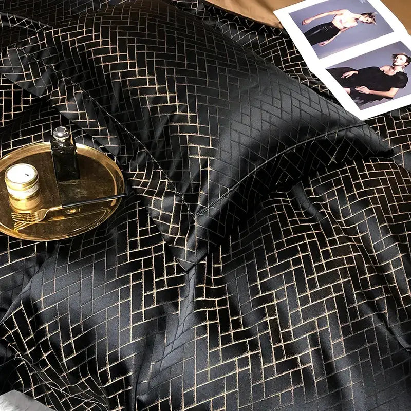 Black satin pillowcases with subtle gold herringbone pattern in decorbites black gold jacquard egyptian cotton bedding set