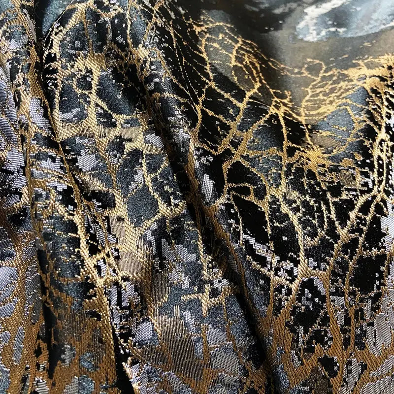 Decorbites black gold jacquard egyptian cotton bedding set with intricate web-like black and gold metallic fabric pattern