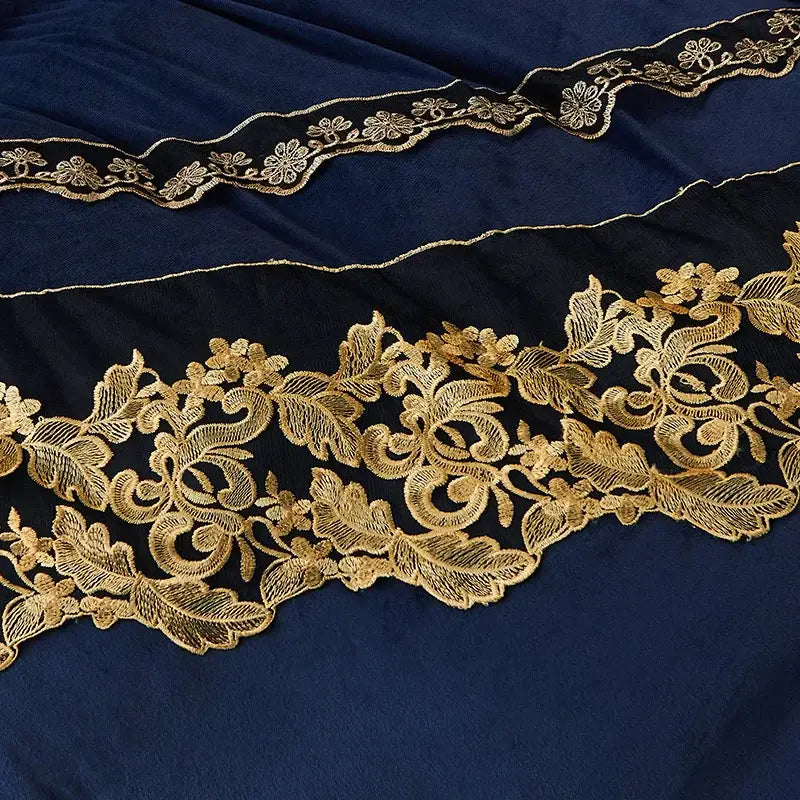 Elegant navy blue fabric with intricate gold floral embroidery on the edges of the decorbites black gold lace duvet set