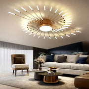 Gold-toned decorbites black gold led chandelier with central circular fixture and slender white arms for modern interiors