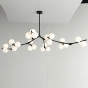 Decorbites black gold led glass ball chandelier with black branch design and frosted globe lights for living room decor