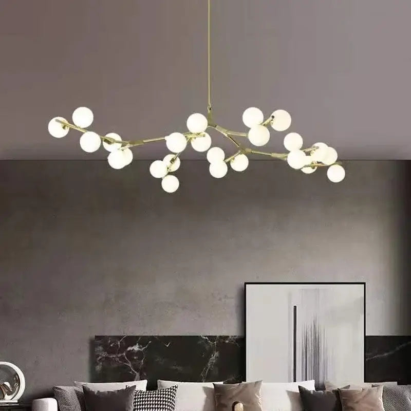 Modern gold-toned decorbites black gold led glass ball chandelier with frosted globes for living room and kitchen décor