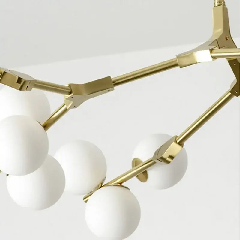 Decorbites black gold led chandelier featuring gold-toned metal and white glass shades for living room decor