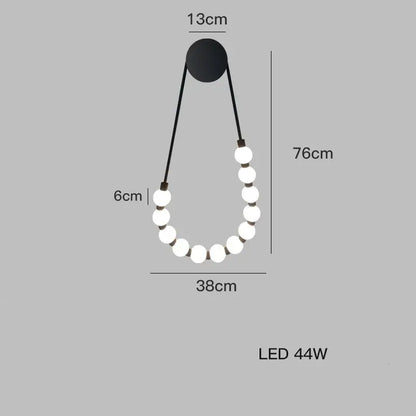 DecorBites black gold LED wall lamp with black pendant and ten glowing white spherical bulbs for bedroom and corridor