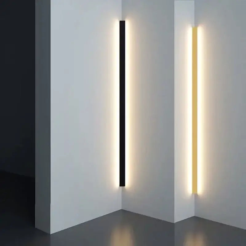 Modern minimalist decorbites black gold wall lights with sleek black and gold led strip design emitting warm ambient light