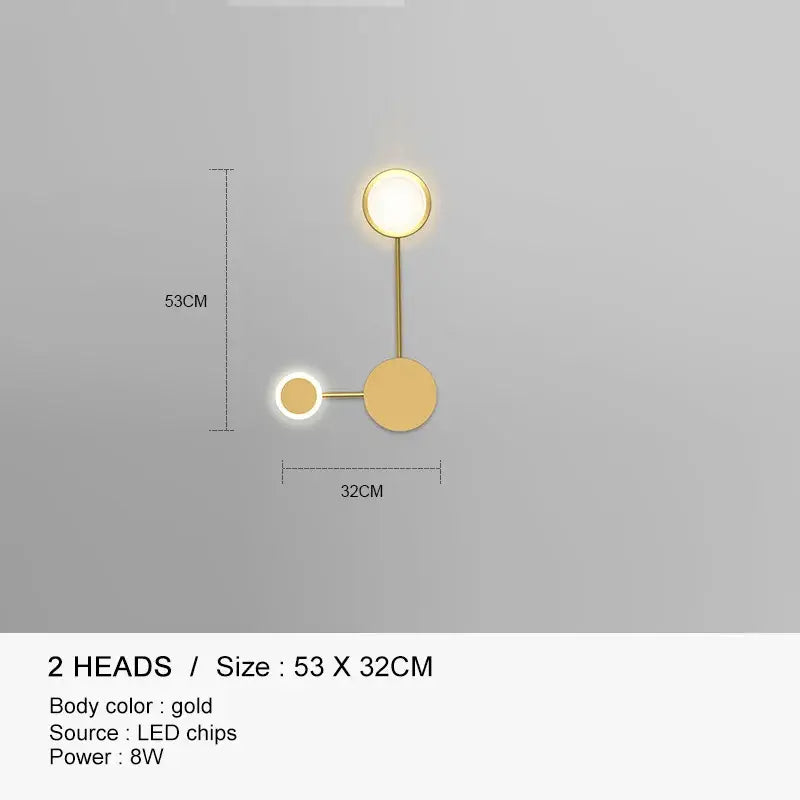 Gold-colored modern wall lamp with two circular LED heads by DecorBites black gold for indoor bedroom and living room use