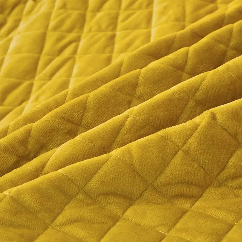 A plush mustard-yellow velvet bedding set with diamond quilted embroidery from decorbites black gold luxury collection