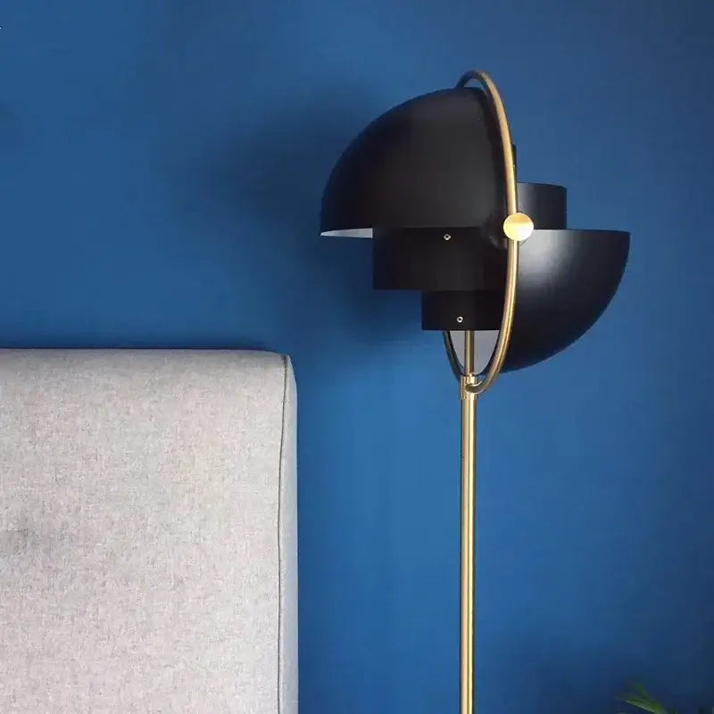 DecorBites black gold metal floor lamp with distinctive black and brass flower-like design for modern living room décor