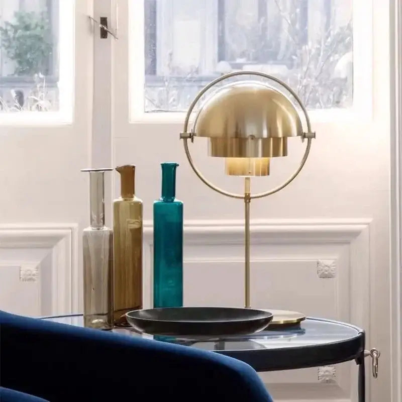 Gold-toned decorbites black gold metal floor lamp with minimalist circular frame and layered petal-like shade for modern décor