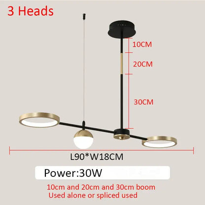 Modern black gold minimalist chandelier by decorbites featuring three black and brass spherical pendant lights for dining room