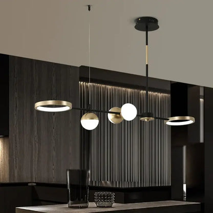 Modern black gold minimalist chandelier by decorbites featuring globe-shaped bulbs for dining room home decor
