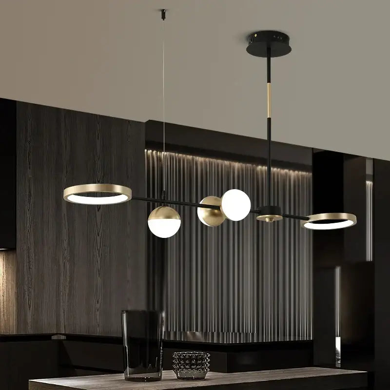 Modern black gold minimalist chandelier by decorbites featuring globe-shaped bulbs for dining room home decor