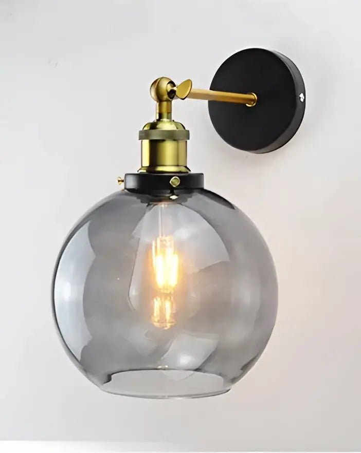 A sleek black gold decorbites black gold molecule smoked glass globe sconce with brass arm for modern loft lighting