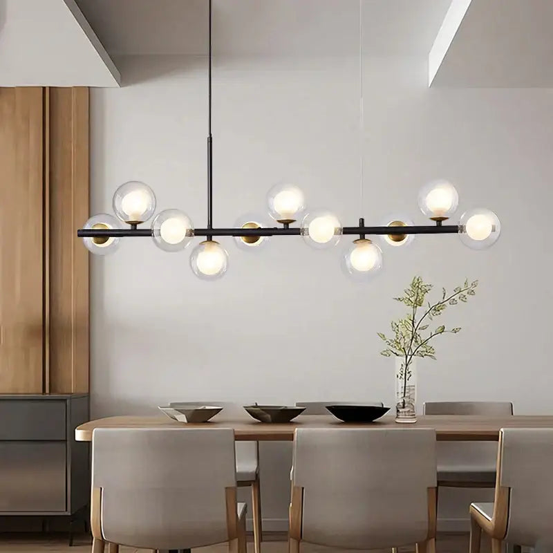 Modern black metal DecorBites black gold nordic pendant chandelier with clear glass globe bulbs for dining and living rooms