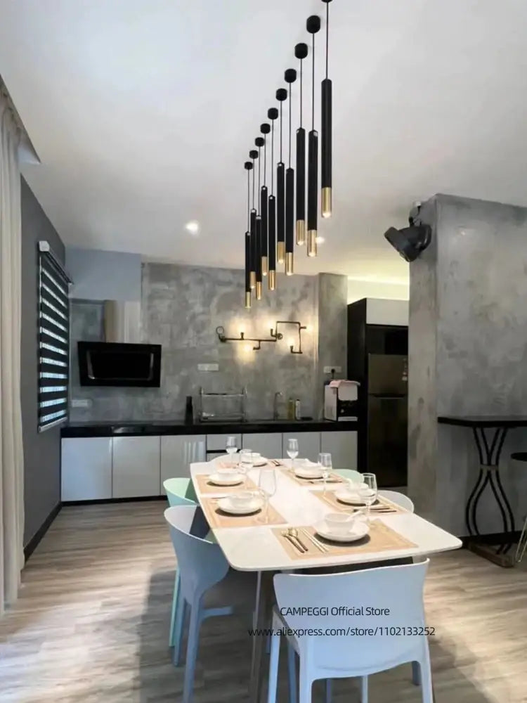 DecorBites black gold pendant lamp modern cylindrical black gold LED fixture hanging above dining table
