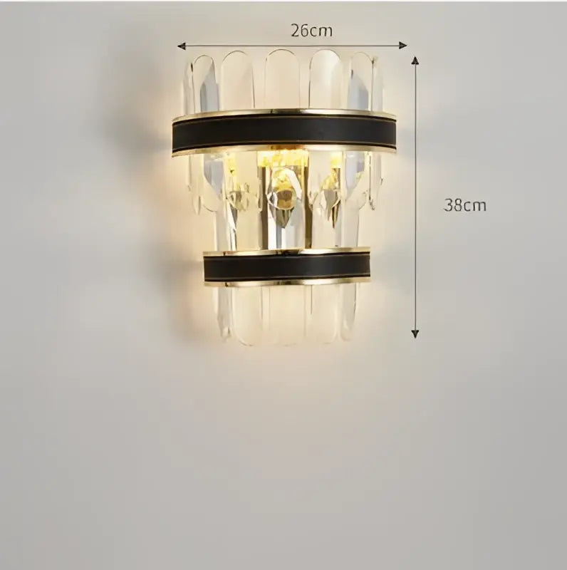 Modern wall sconce with clear crystal prisms and black leather-wrapped metal bands from DecorBites black gold round LED collection