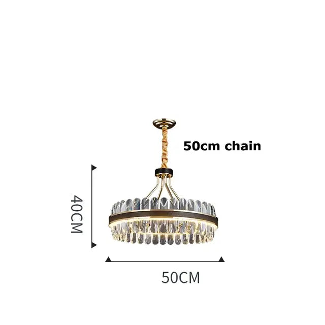 A modern decorbites black gold round led crystal chandelier with gold-toned frame and clear faceted crystals suspended by a 50cm chain