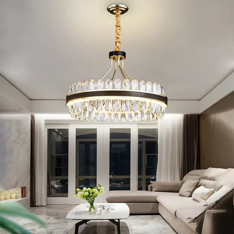A decorbites black gold round led crystal chandelier with gold metal frame and clear teardrop crystals for living room