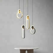 Modern minimalist decorbites black gold pendant light with sleek black gold round illuminated edges for bedside use