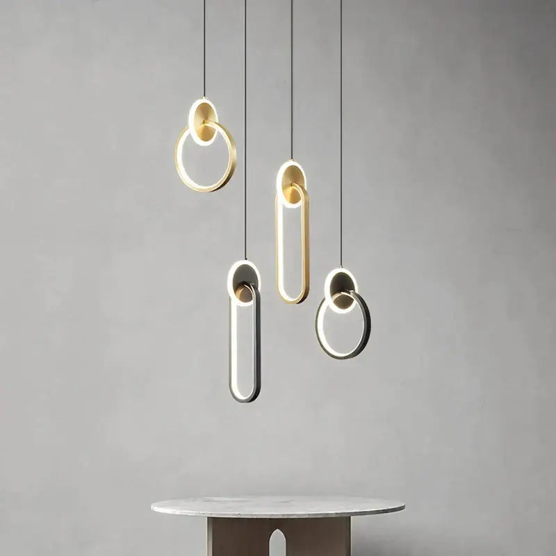 Modern minimalist decorbites black gold pendant light with sleek black gold round illuminated edges for bedside use