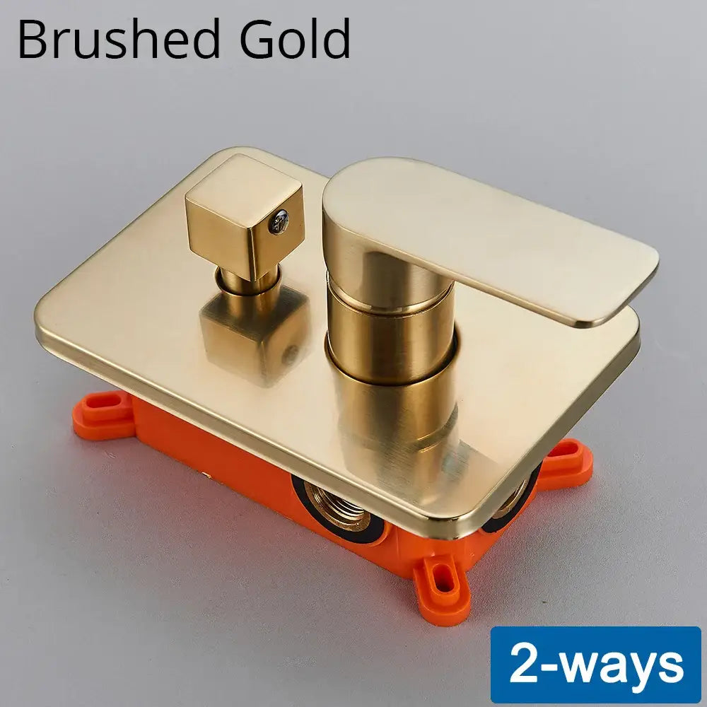 Brushed gold modern bathroom faucet with rectangular spout and square handle on orange base for shower mixing valve