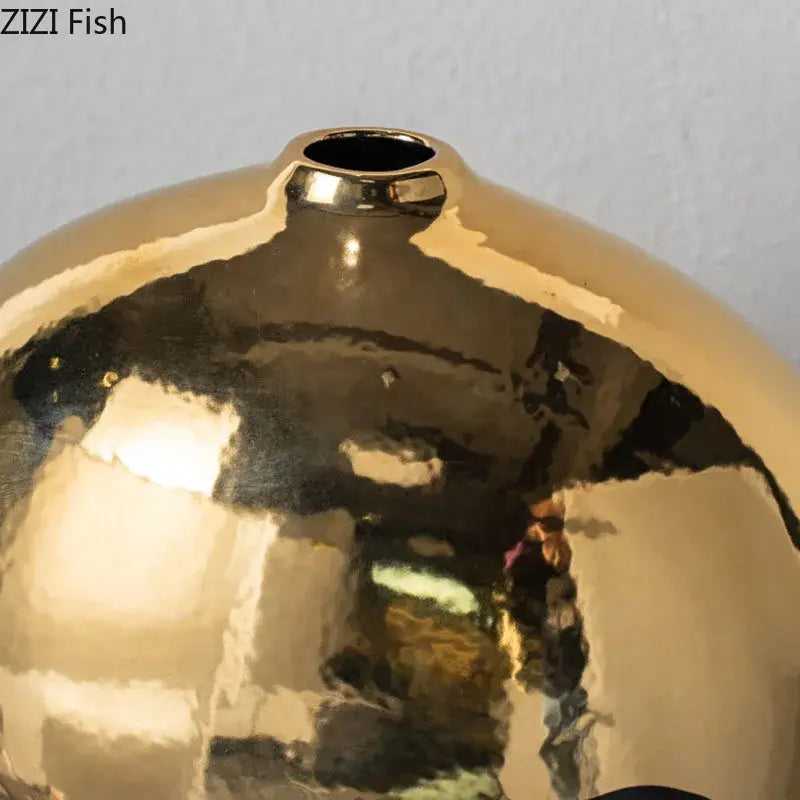 Decorbites black golden ceramic vase with shiny gold metallic rounded surface and narrow opening for minimalist decor