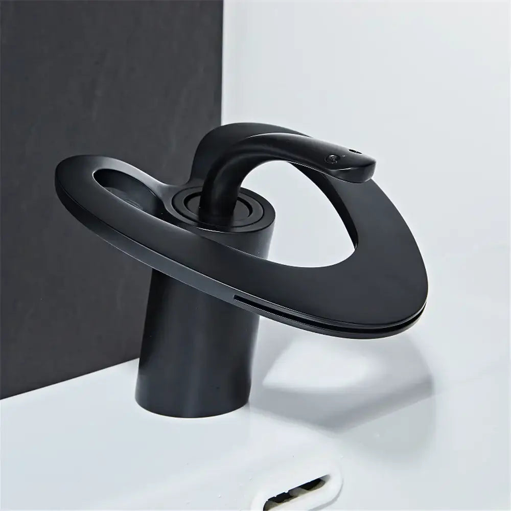 Decorbites black gray brass waterfall basin faucet in matte finish featuring modern sculptural design for hot cold mixing