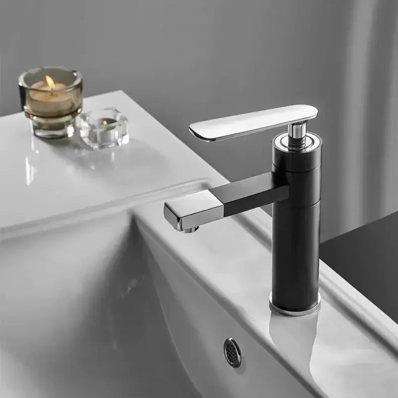 Modern black and chrome DecorBites™ waterfall basin faucet with sleek minimalist design for hot and cold water mixing
