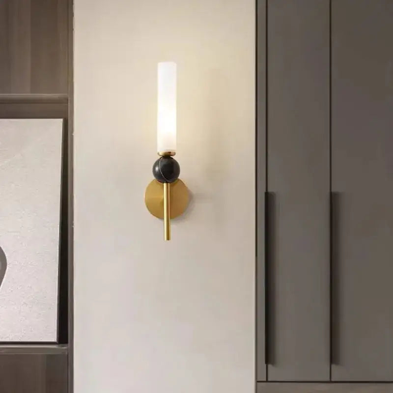 DecorBites™ gold-toned wall lamp sconce with frosted glass cylinder and black accent featuring copper acrylic lampshade