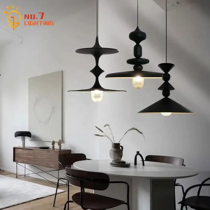 Decorbites black gyroscope pendant lights in black matte iron with stacked disc design and warm led g9 bulbs