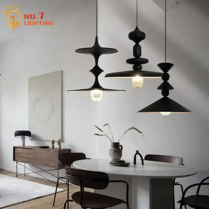 Decorbites black gyroscope pendant lights in black matte iron with stacked disc design and warm led g9 bulbs