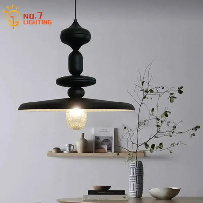 Decorbites black gyroscope pendant lights feature a black matte iron art design with tiered sculptural form and warm-toned bulb