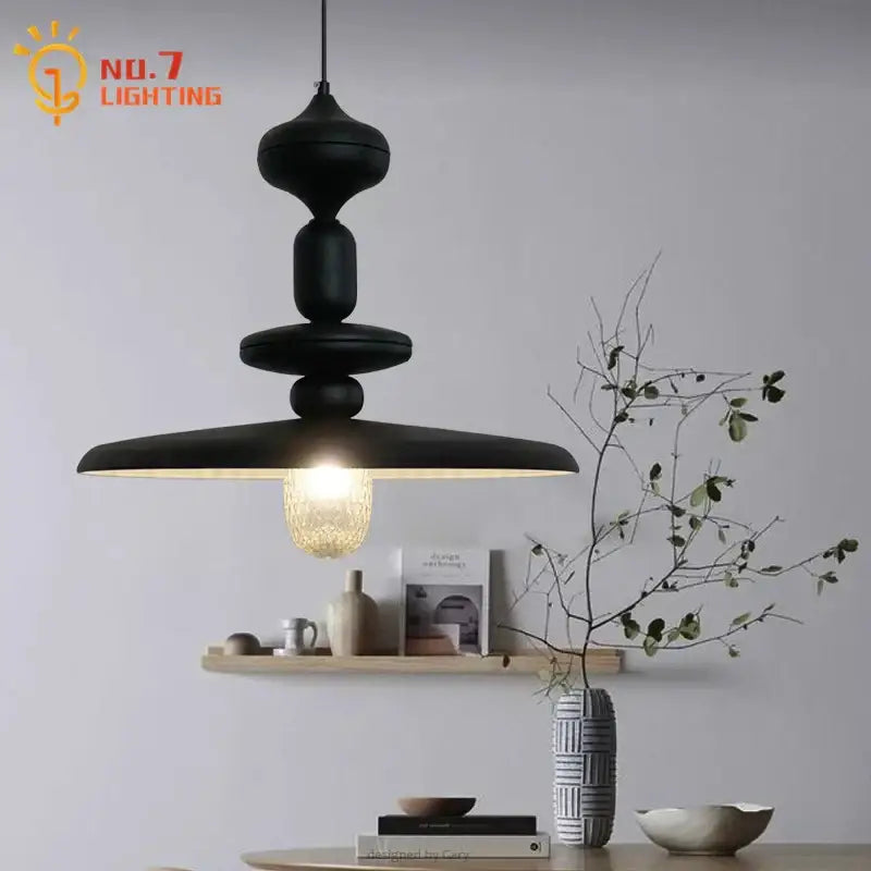 Decorbites black gyroscope pendant lights feature a black matte iron art design with tiered sculptural form and warm-toned bulb