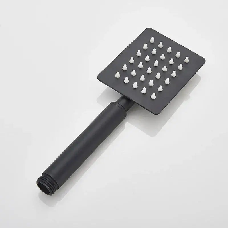 Black matte-finish decorbites™ hand-held shower head with white nozzle tips for high pressure and water saving use
