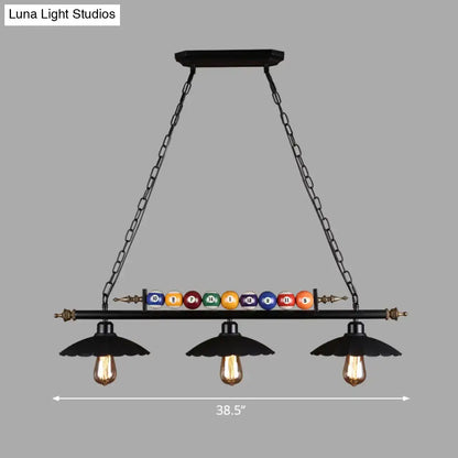 Black wrought iron pool table light fixture with 3-light suspension lamp and colorful billiard balls on central bar