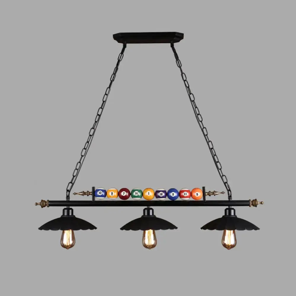 Black industrial metal linear island light with 3-light suspension lamp and colorful billiard balls on central bar